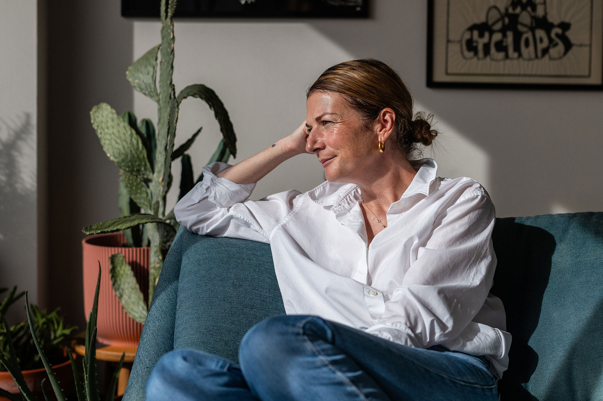 Eliza Fricker photographed relaxing at home on a sofa